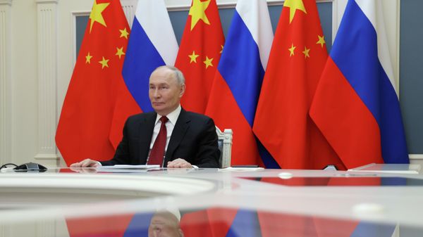 Президент РФ Владимир Путин проводит по видеоконференции переговоры с председателем КНР Си Цзиньпином