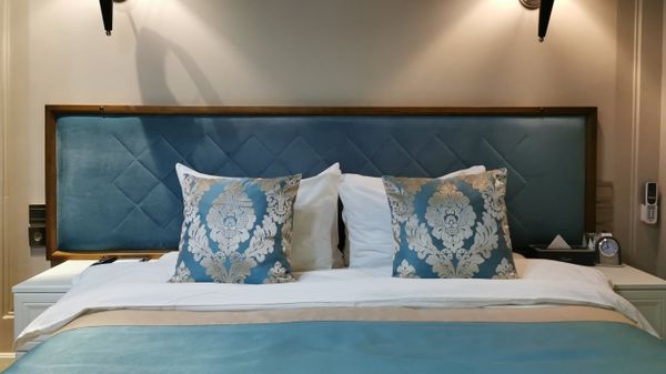 Кровать в гостинице Xander Hotel